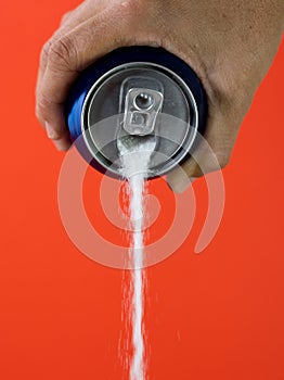 Can pouring sugar stream in calories content of soda energetic and refreshing drinks