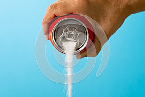 Can pouring sugar stream in calories content of soda energetic and refreshing drinks