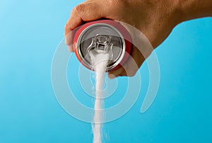 Can pouring sugar stream in calories content of soda energetic and refreshing drinks