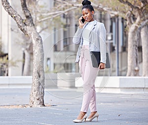 We can review it once I get there. a young businesswoman making a phone call using her smartphone.