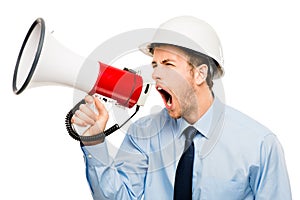 Can you hear me now. a businessman shouting into a megaphone against a studio background.