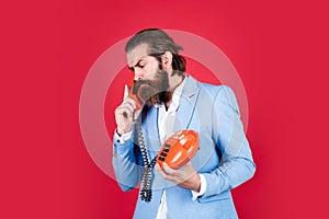 Can you hear me now. serious man with retro phone. brutal bearded man hold vintage telephone. concept of technology in