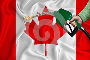 CANADA flag Close-up shot on waving background texture with Fuel pump nozzle in hand. The concept of design solutions. 3d