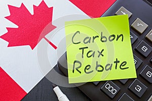Canada flag and sticker carbon tax rebate.