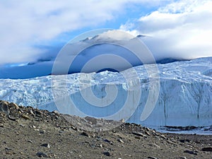 Canada Glacier flowing into Taylor Dry Valley with mountain in background in Antarctica