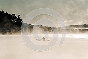 Canada Ontario Lake of two rivers Canoe Canoes foggy water sunrise fog golden hour on water in Algonquin National Park