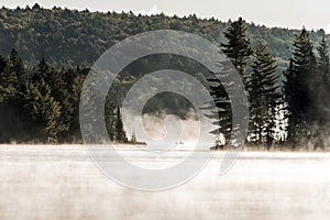 Canada Ontario Lake of two rivers Canoe Canoes foggy water sunrise fog golden hour on water in Algonquin National Park