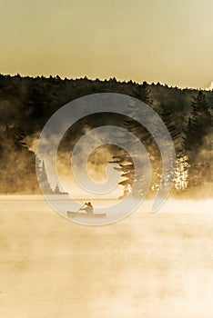 Canada Ontario Lake of two rivers Canoe Canoes foggy water sunrise fog golden hour on water in Algonquin National Park