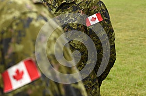 Canada patch flags on soldiers arm. Canadian troops
