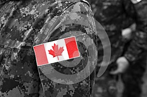 Canada patch flags on soldiers arm. Canadian troops