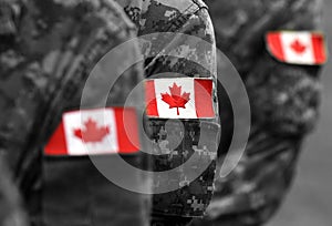 Canada patch flags on soldiers arm. Canadian troops