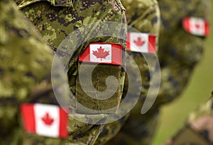 Canada patch flags on soldiers arm. Canadian troops