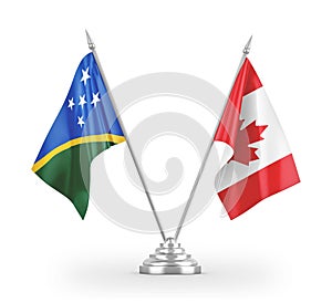 Canada and Solomon Islands table flags isolated on white 3D rendering