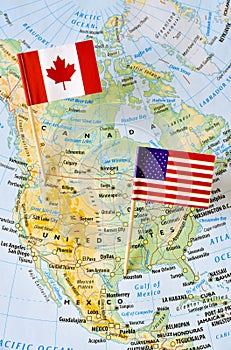 Canada and USA flag pin on map
