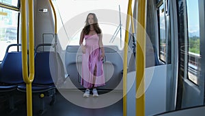 Canada Vancouver Sky Train girl walking along the train car pink dress summer beautiful young European