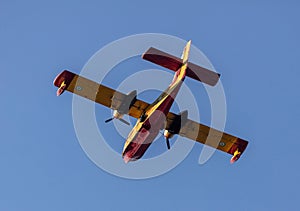 Canadair flight, Firefight Aircraft, scooper flying on blue sky, under view