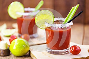 Canadian Caesar drink. Made with vodka, hot sauce and Worcestershire sauce, served with ice in a celery glass with a salted rim,