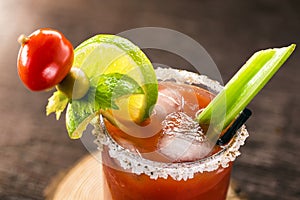 Canadian Caesar drink. Made with vodka, hot sauce and Worcestershire sauce, served with ice in a celery glass with a salted rim,