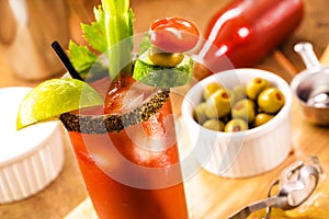 Canadian Caesar drink, typical Canadian drink, with hot sauce, celery, lemon, vodka and ice