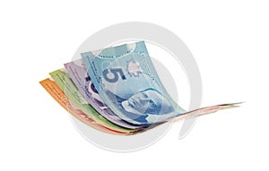 Canadian dollar bills presented as flying in the air,