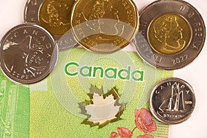 Canadian dollar currency coins. Circulating Canadian dollar coins or currency in the market. photo