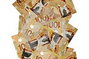 100 Canadian dollars bills flying down isolated on white. Many banknotes falling with white copyspace on left and right side