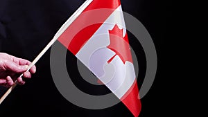 Canadian flag on black background
