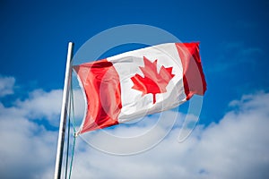 Canadian flag flying in the breeze