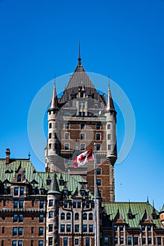 Canadian flag flying in front of the Chateau Frontenac in Quebec City.