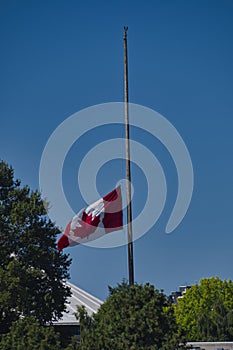 Canadian flag flying at half-mast.   Vancouver BC Canada