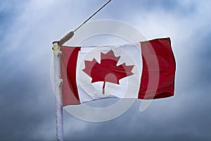 Canadian flag flying in the wind photo