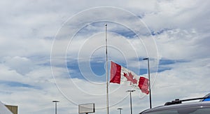 Canadian flag at half mast