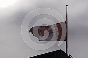 canadian flag at half mast against sky