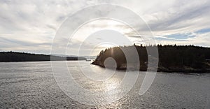 Canadian Landscape by the ocean and mountains. Summer Season Sunset