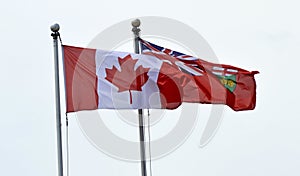 Canadian and Ontario Flags at full mast