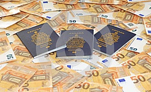 Canadian Passports on the fifty EURO bills background