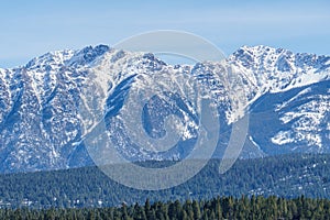 Canadian Rockies with snow in British Columbia Canada early spring clear sky