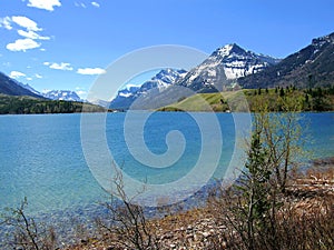 Canadian Rocky Mountains and Prince of Wales Hotel from Driftwood Bay, Waterton Lakes National Park, Alberta