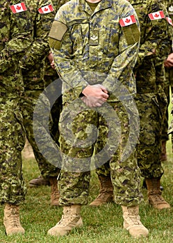 Canadian troops. Canadian Army. Canada flags on soldiers arm.