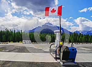 Canadian Wilderness Gas Station With Canadian Flag And Motorhome