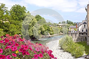 Canal behind some petunias in Oloron Saint Marie