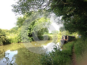 A canal boat in the distance on the Oxford Union Canal