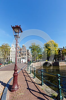 Canal and bridges traditional Dutch houses at Keizersgracht portrait format in Amsterdam, Netherlands