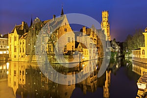 A canal in Bruges with the famous Belfry in Belgium