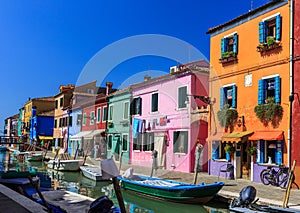 Canal with colorful houses on the famous island Burano, Venice, Italy