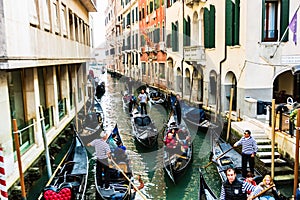 Canal with gondolas in Venice, Italy. Architecture, landmarks and tourists in Venice