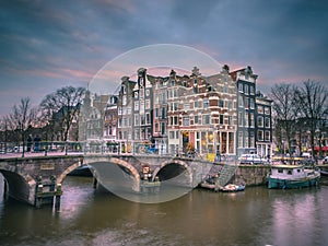 Canal houses sunset Amsterdam retro look