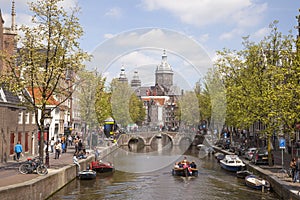 Canal and nicolaaskerk in amsterdam red light district