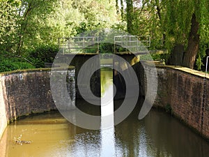 Canal and old water lock photo