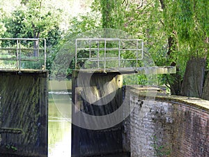 Canal and old water lock photo